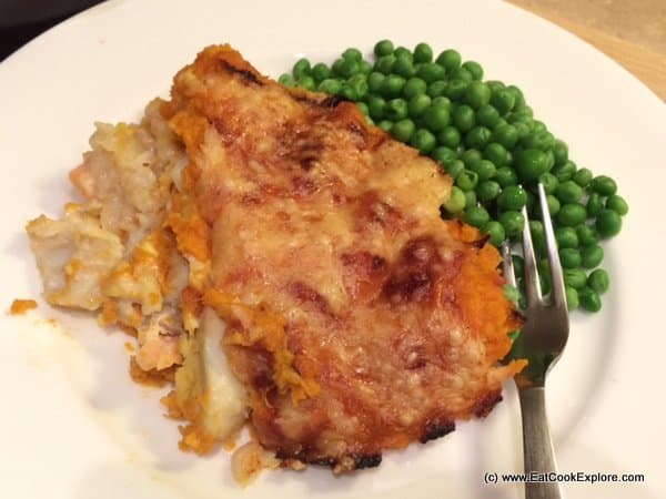 Fish-Pie-with-Roasted-Garlic-Sweet-Potato-Mash served with peas